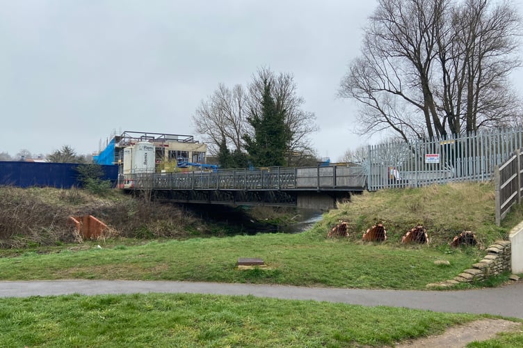 Planning permission was granted for Crest Nicholson's temporary Brightwells Yard construction access to the A31 in 2018. Once the development is complete, the bridge will be dismantled and replaced with a permanent bridge for pedestrians – and possibly cyclists too...