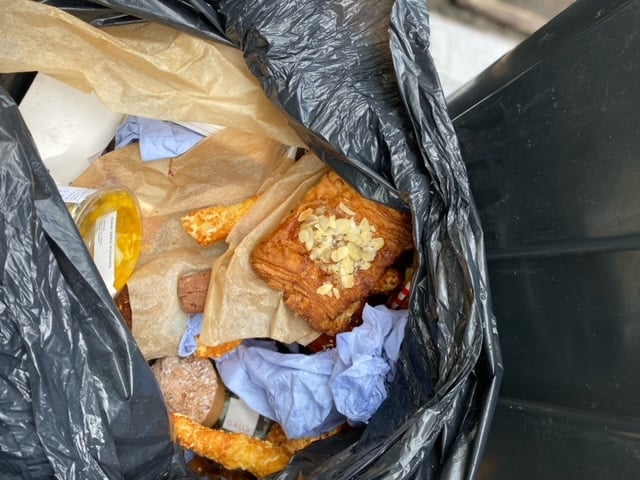 Debbie Flowerday counted eight black bin-liners full of bread and pastries outside of Gail's Bakery in Farnham