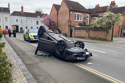 Video: Car overturns after collision with mobility scooter in Farnham
