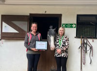 Treloar's presents certificate to Broadlands Riding for the Disabled