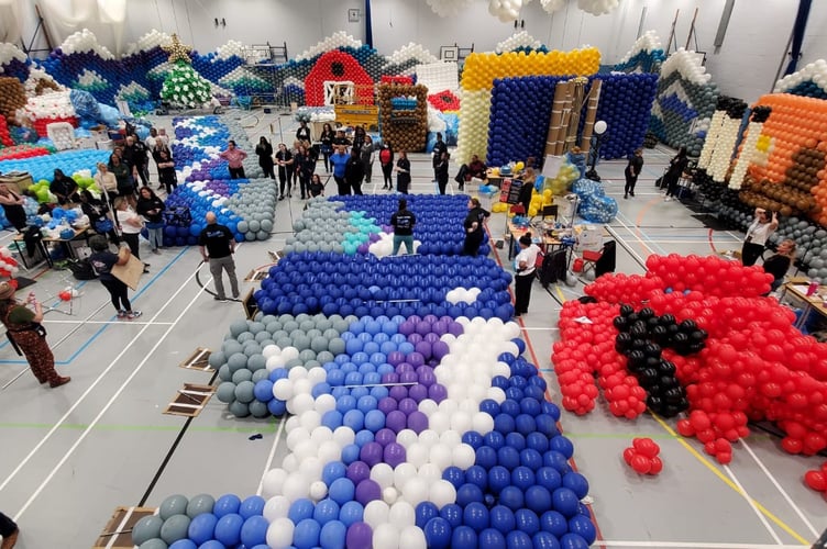 Balloon artists from around the world have created an array of London Christmas sights out of more than 125,000 balloons to raise funds for four Surrey charities