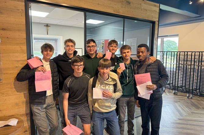 Students holding their results after an anxious wait 